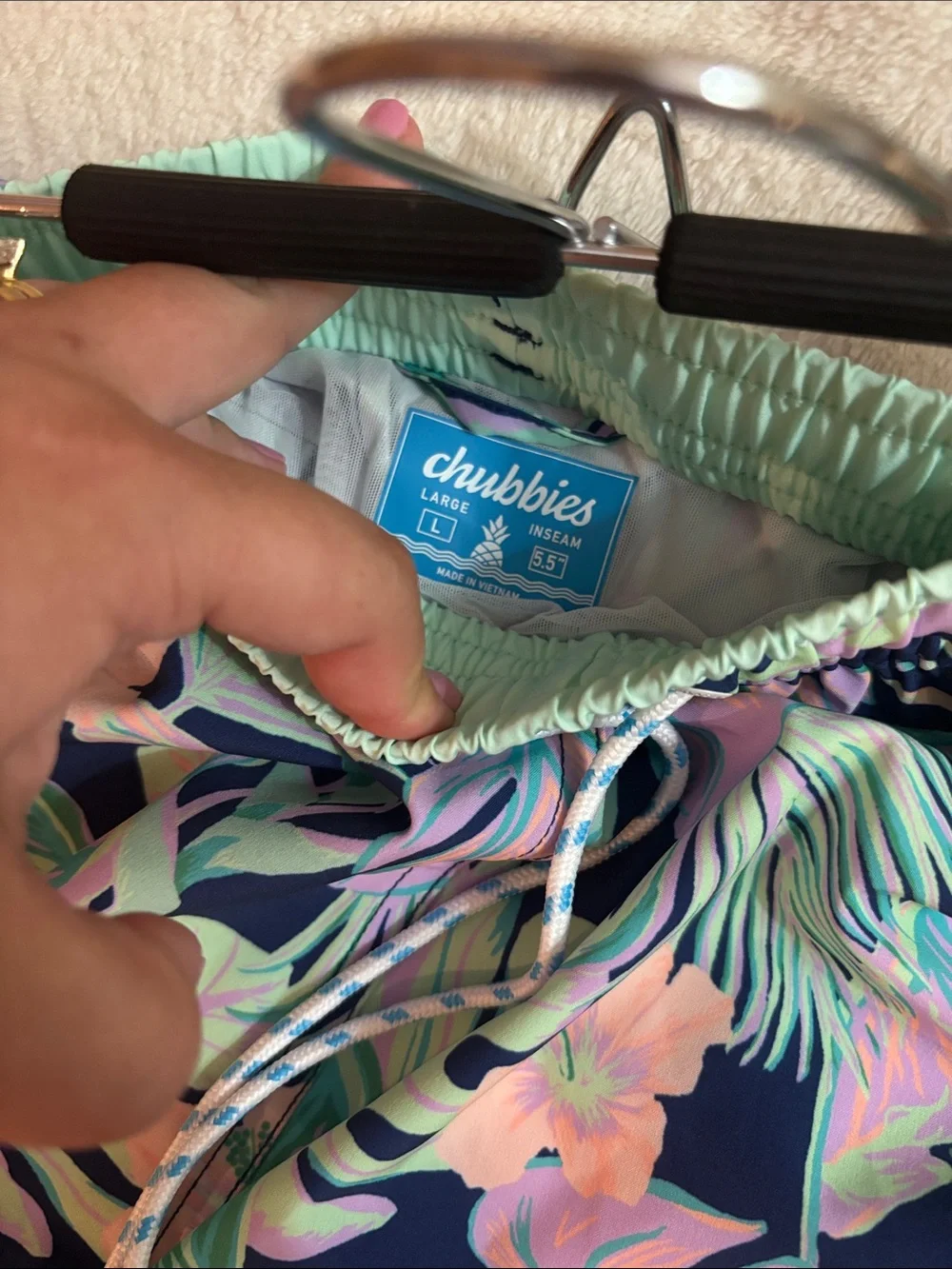 chubbies Navy Tropical Leaf Print Swim Trunks with Pastel Accents